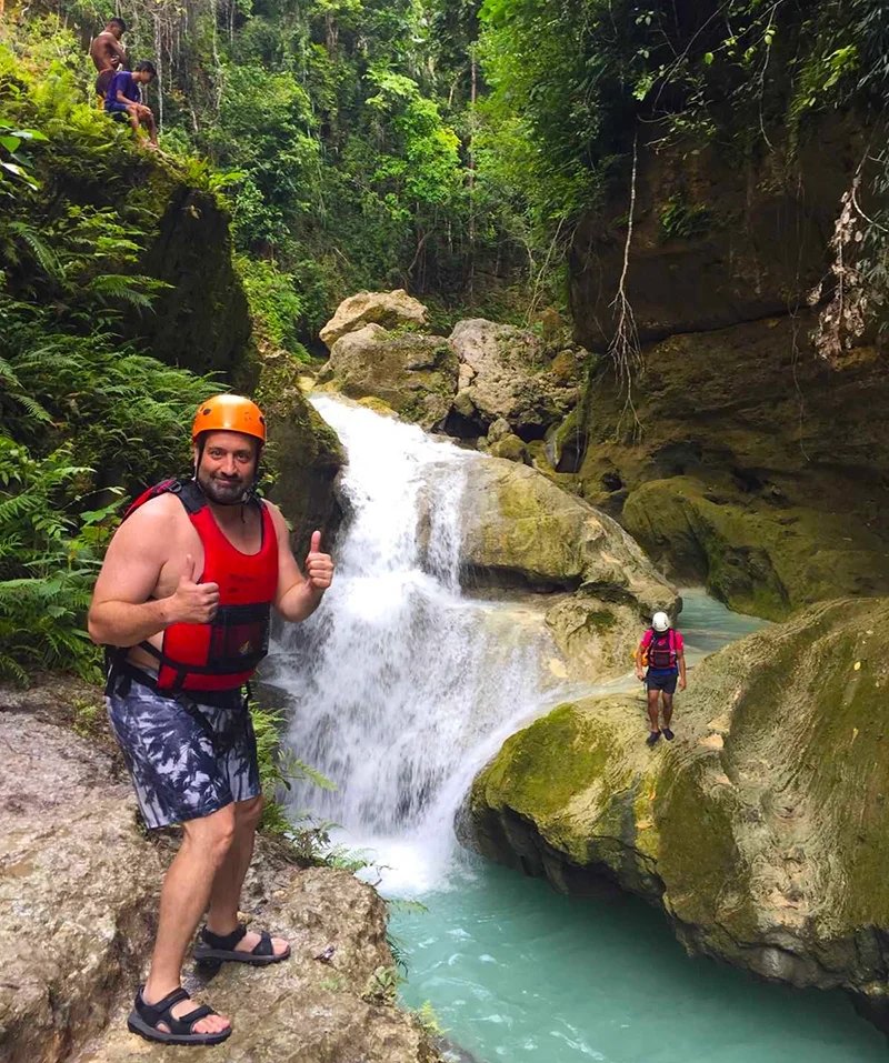 A guy ready to jump in the canyoneering adventure in Cebu Canyoneering in Cebu